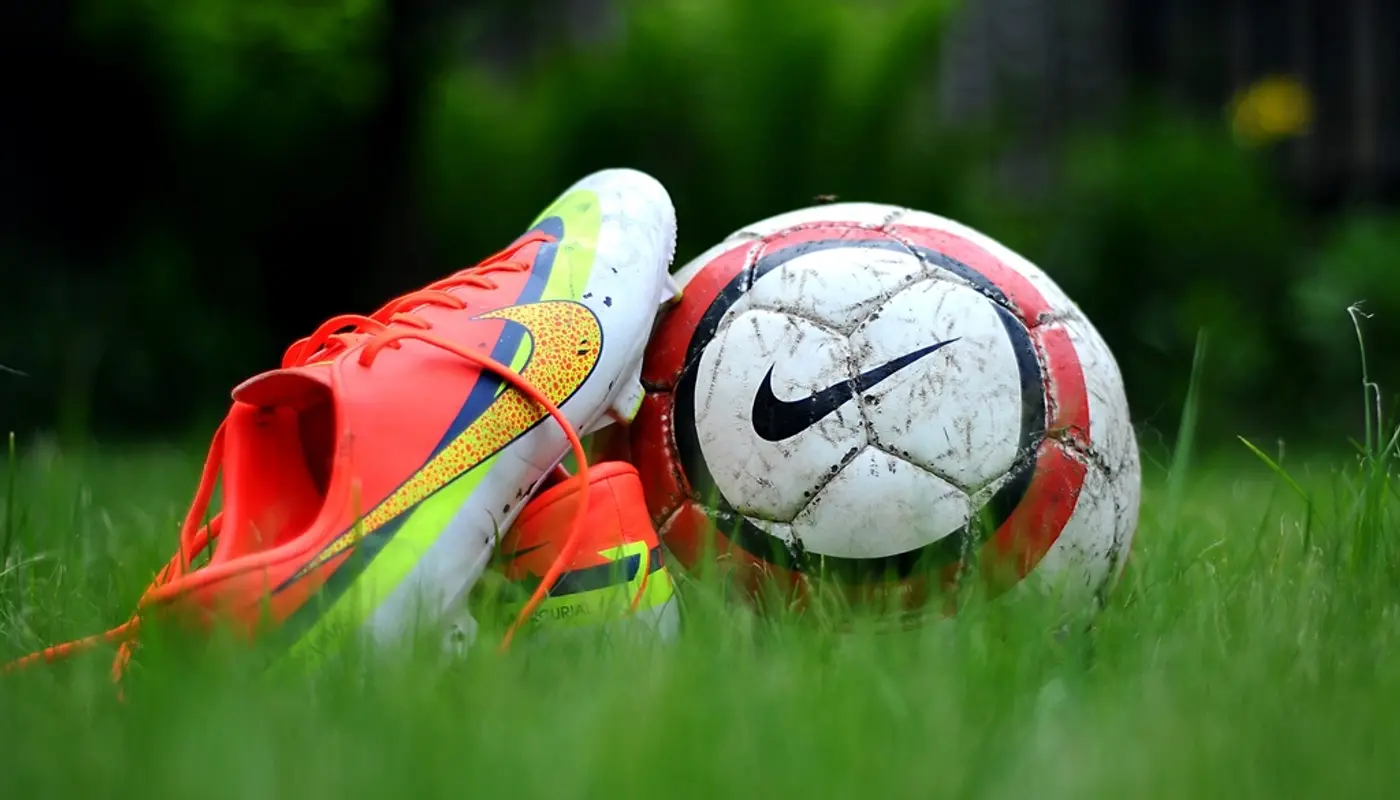 Closeup Nike football boots grass